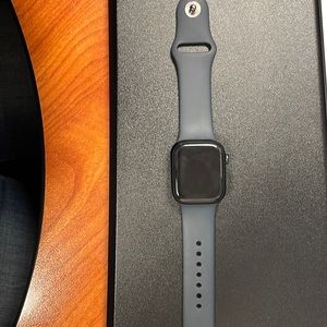 Series 7 Apple Watch w/ blue band has to bands for sizing, comes w/ the charger